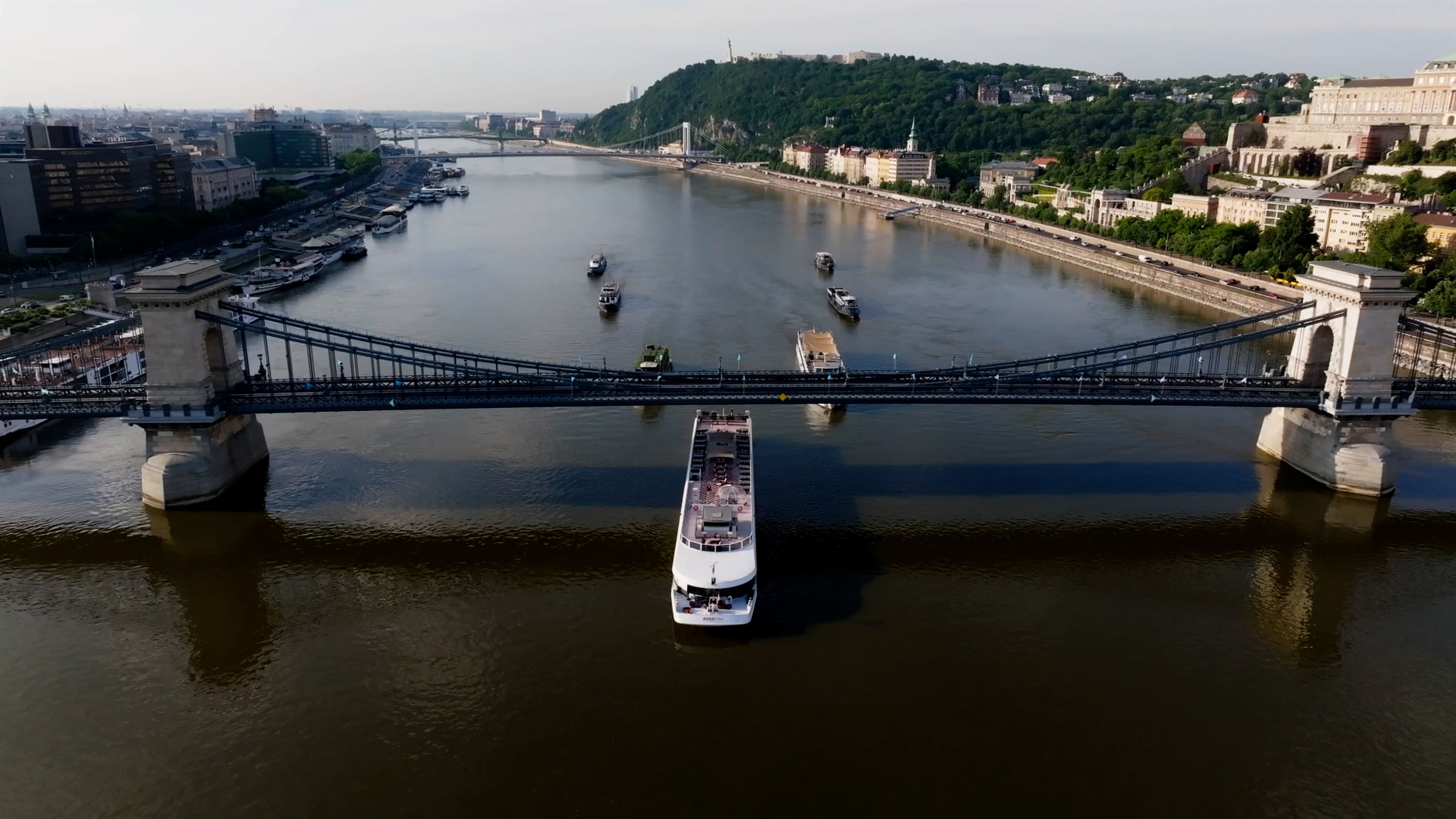 River Diva dinner cruise ship sailing beneath the Chain Bridge in Budapest