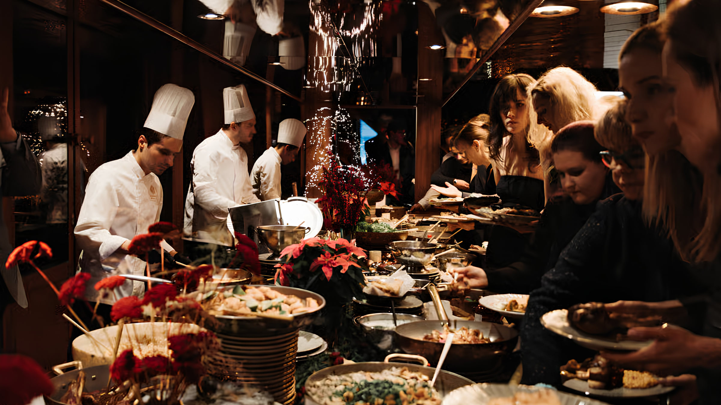 Guests choosing dishes from the dinner buffet aboard River Diva