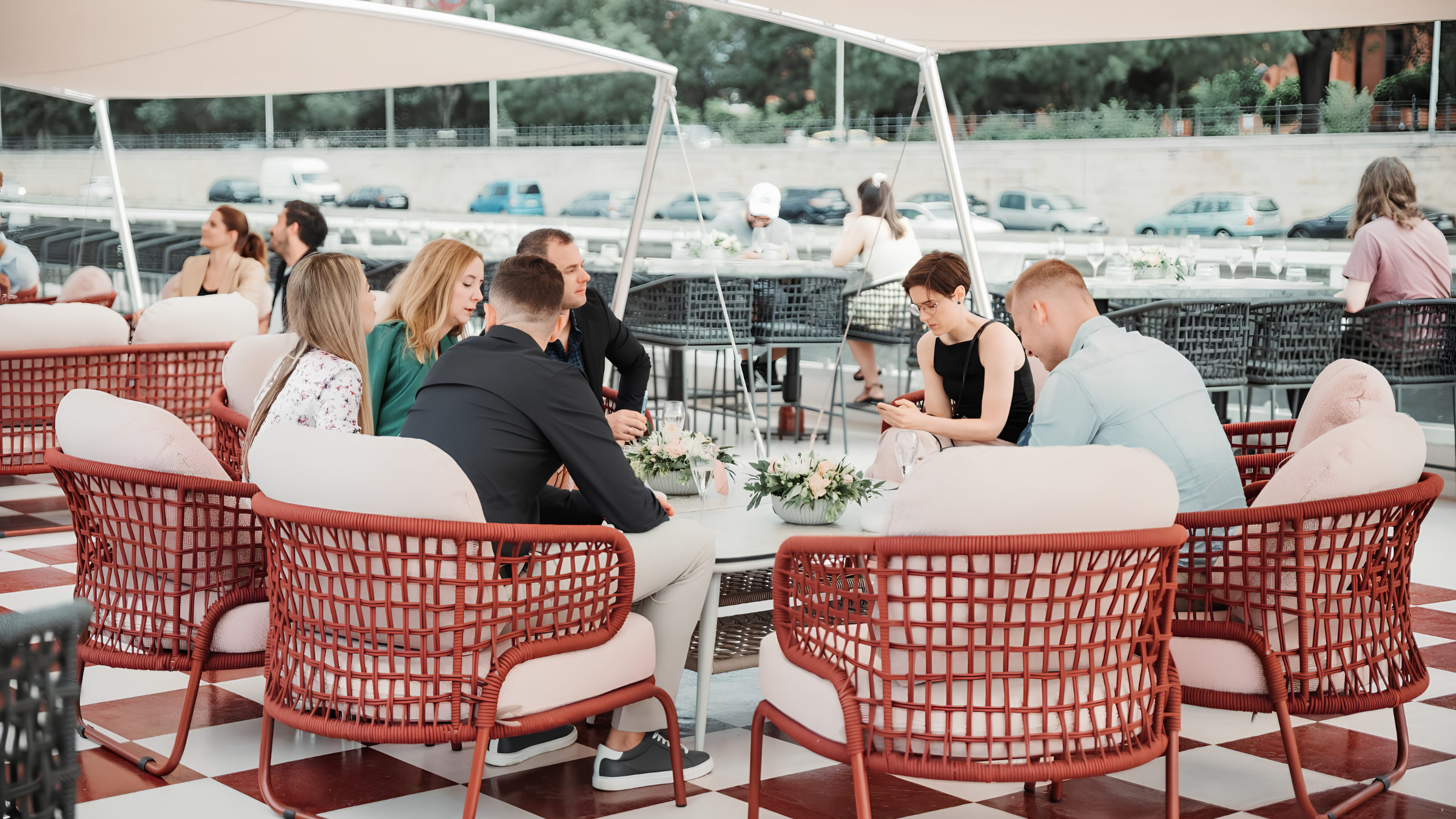 Guests relaxing on the open-air deck during a Budapest dinner cruise